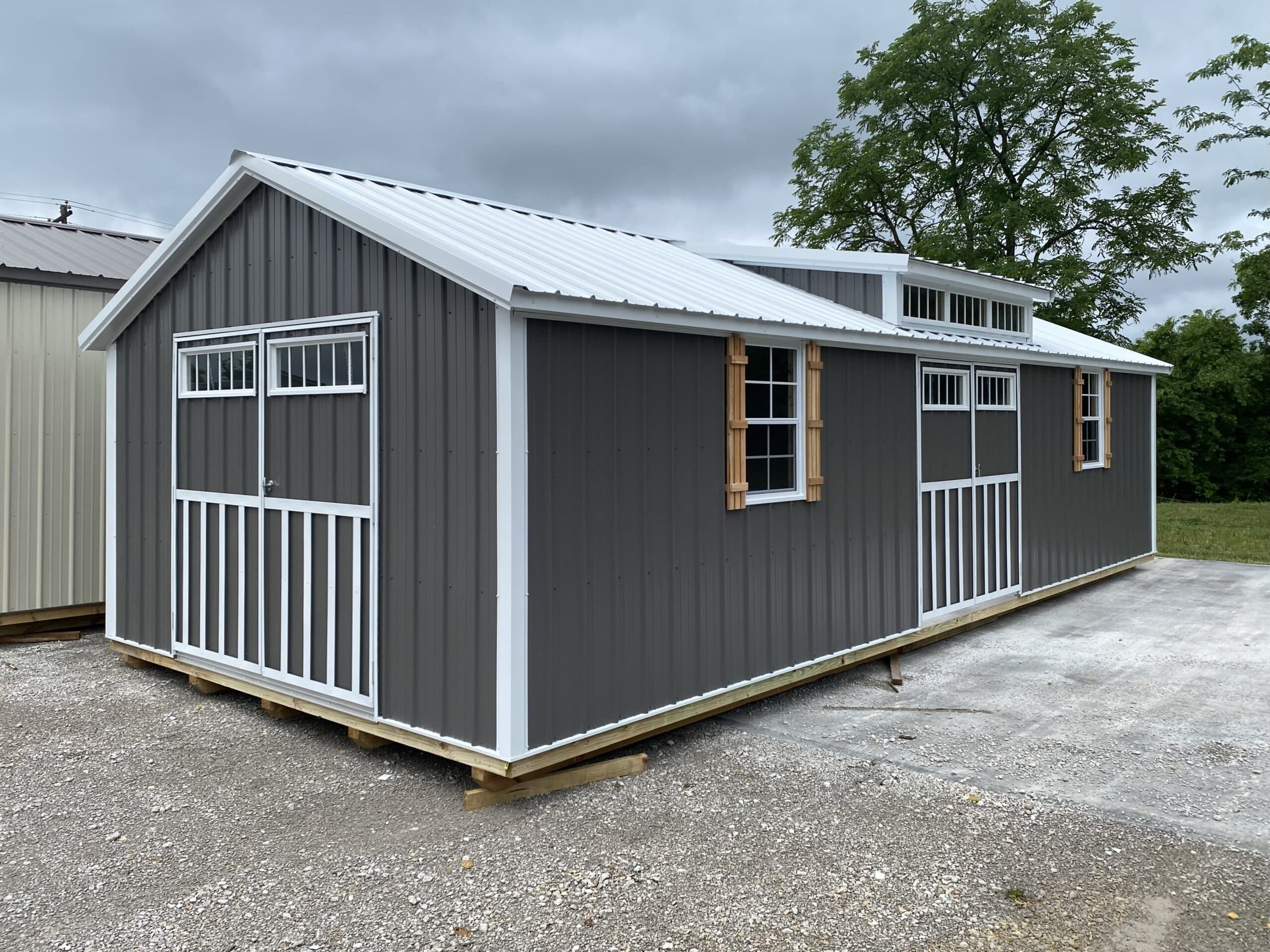 14x44 grey cottage-shed with white trim and white metal roof for sale in MO & KY