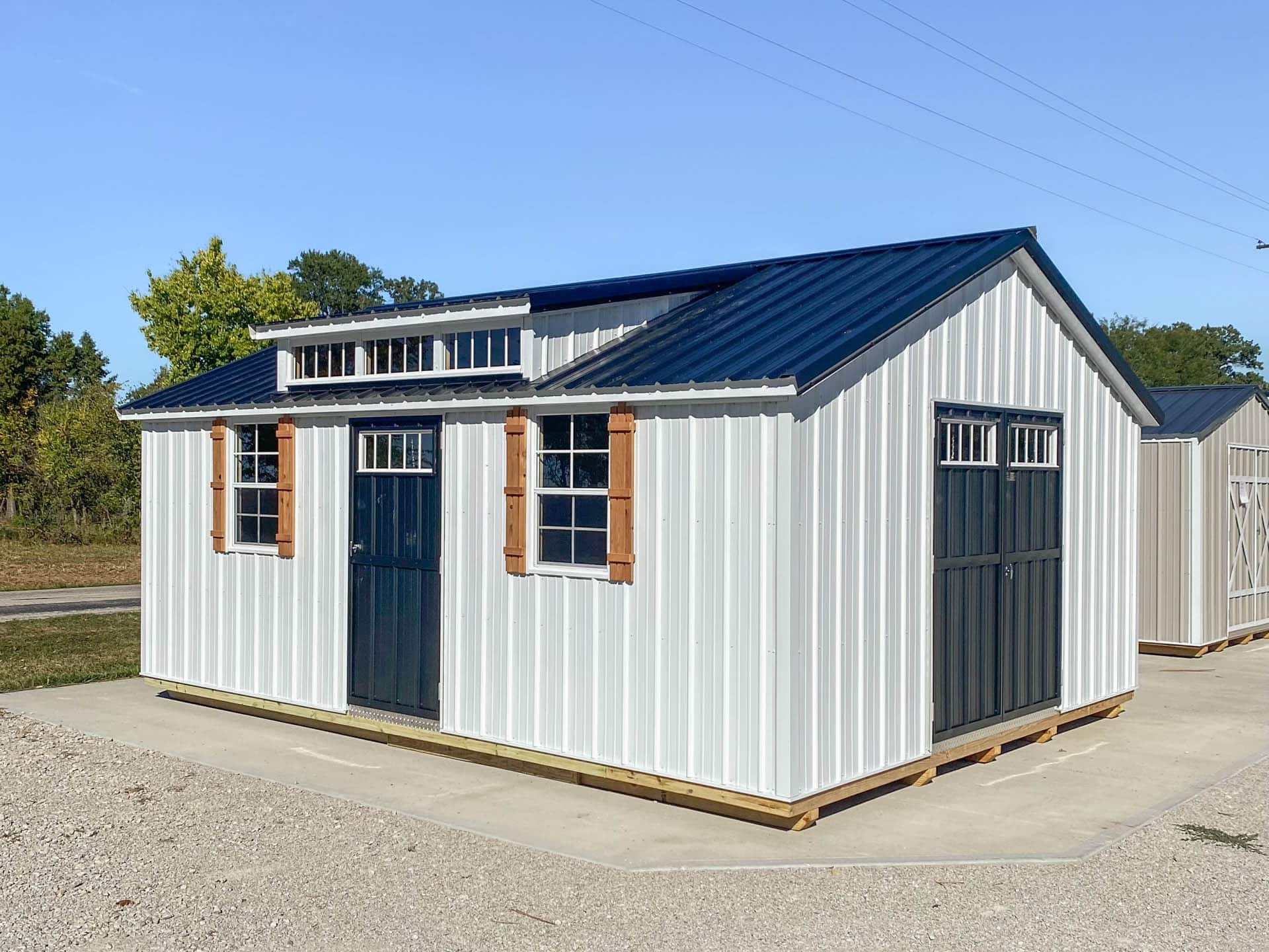 14x44 white metal cottage shed with blue metal roof for sale in MO & KY