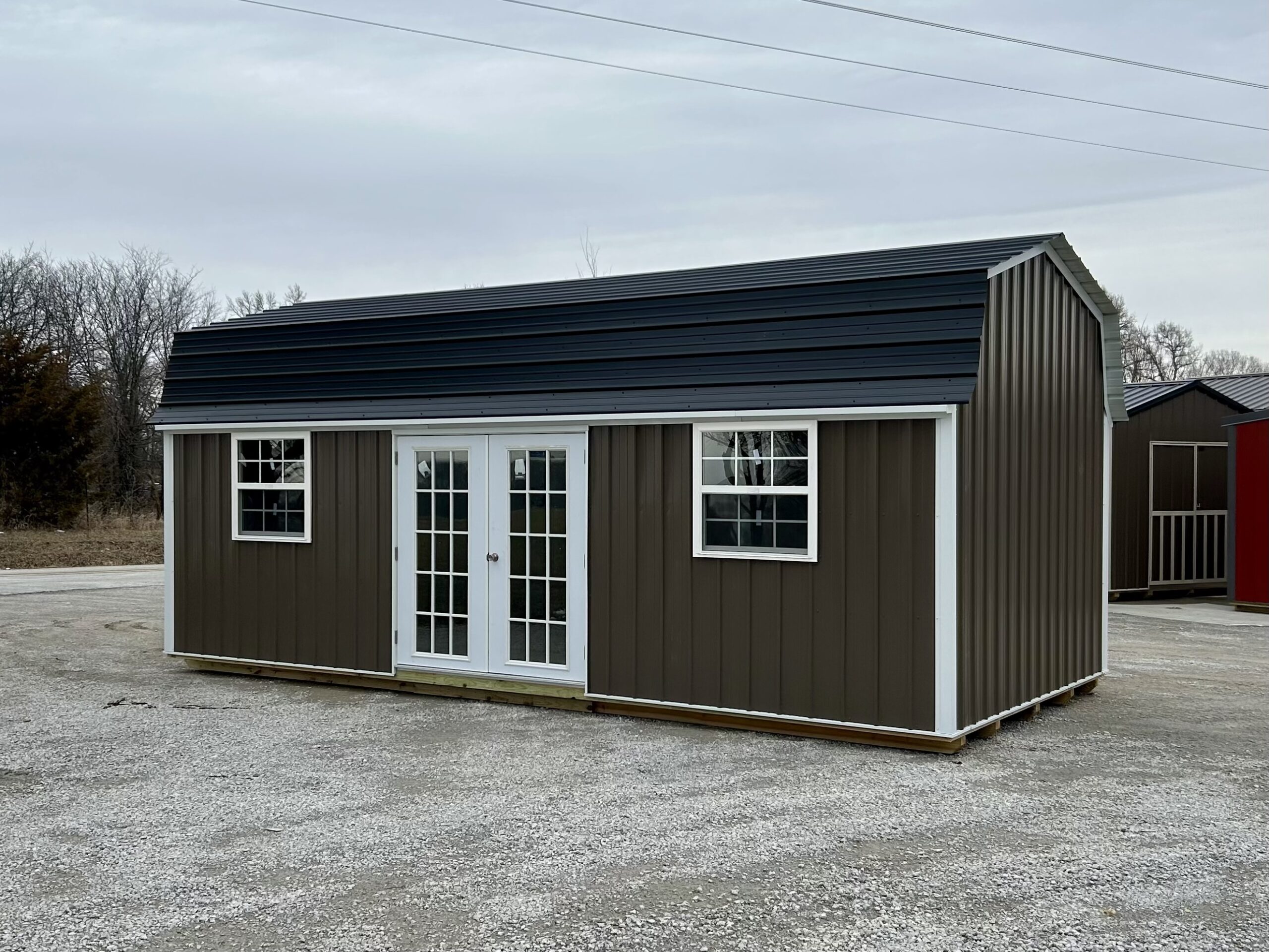 brown barn shed with white trim for sale near Overland Park KS