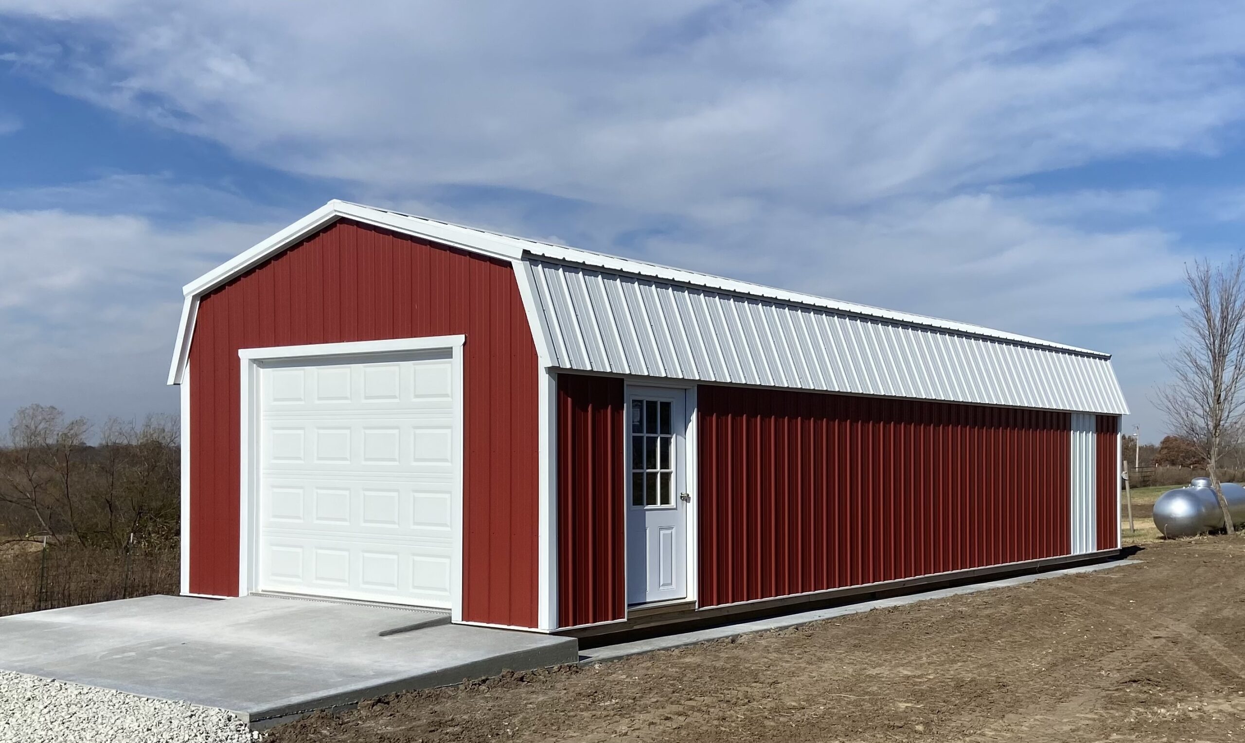 a red barn garage with a white roof and a white garage door for sale near Overland Park KS